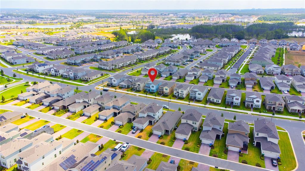 An aerial view shows a suburban neighborhood with rows of houses and a red location pin — 16596 POINT ROCK DRIVE, WINTER GARDEN, FL