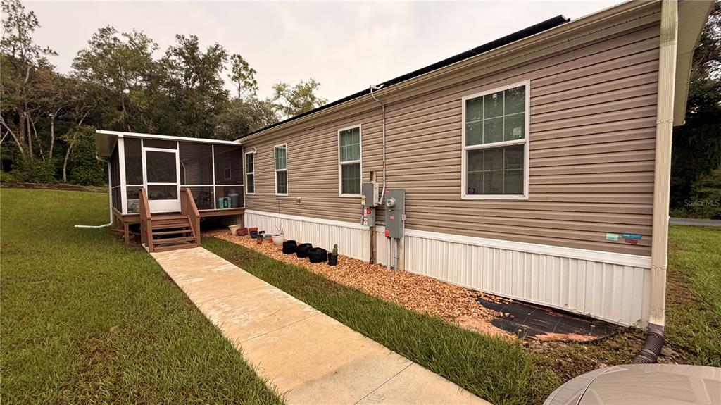 This is a floor plan for a single-story house with three bedrooms and a screened porch — 6988 N PALMER WAY, HERNANDO, FL