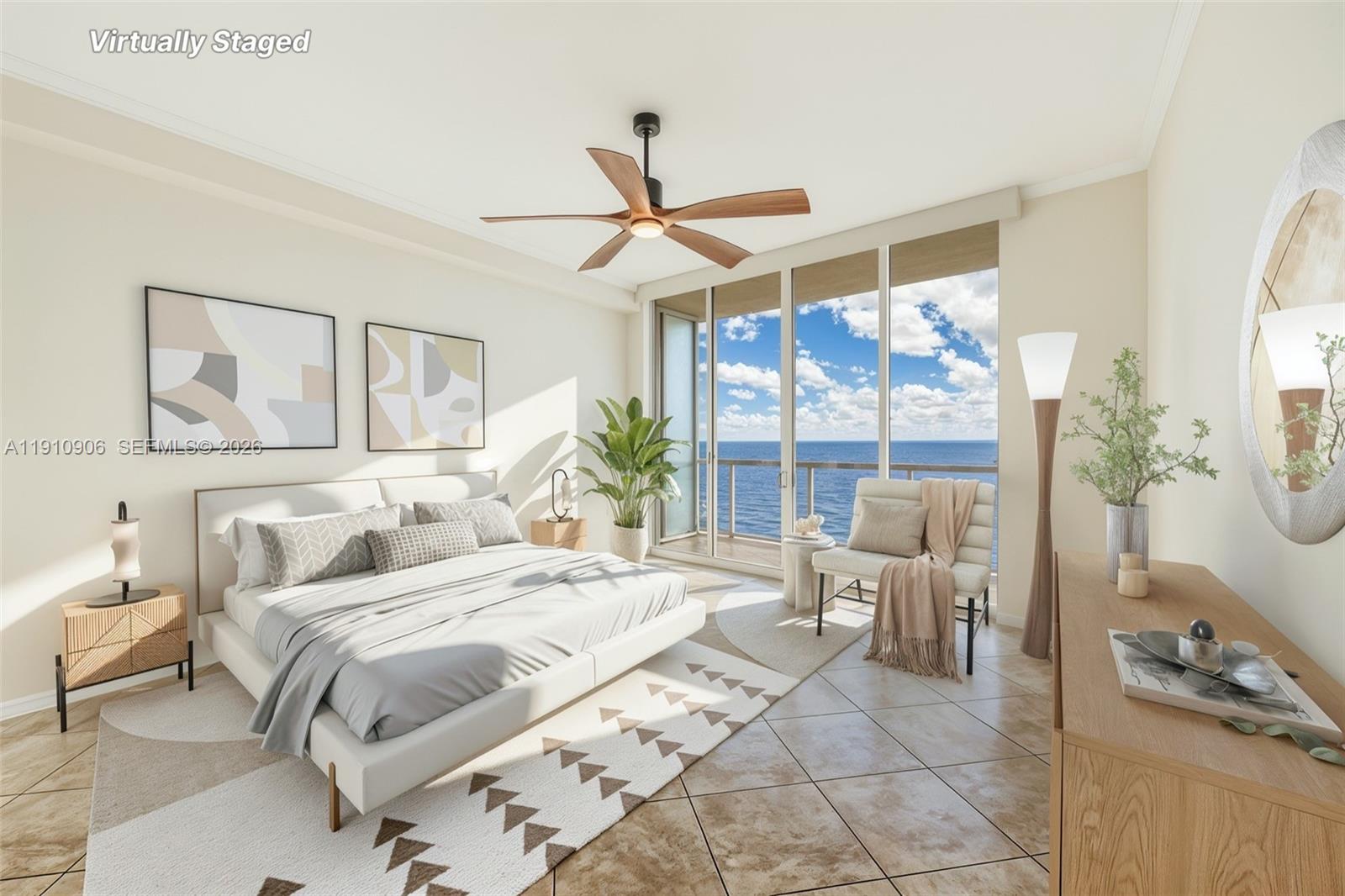 This virtually staged bedroom features a bed, seating area, and floor-to-ceiling windows overlooking the ocean — 704 N Ocean Blvd # 1001, Pompano Beach FL 33062, POMPANO BEACH, FL