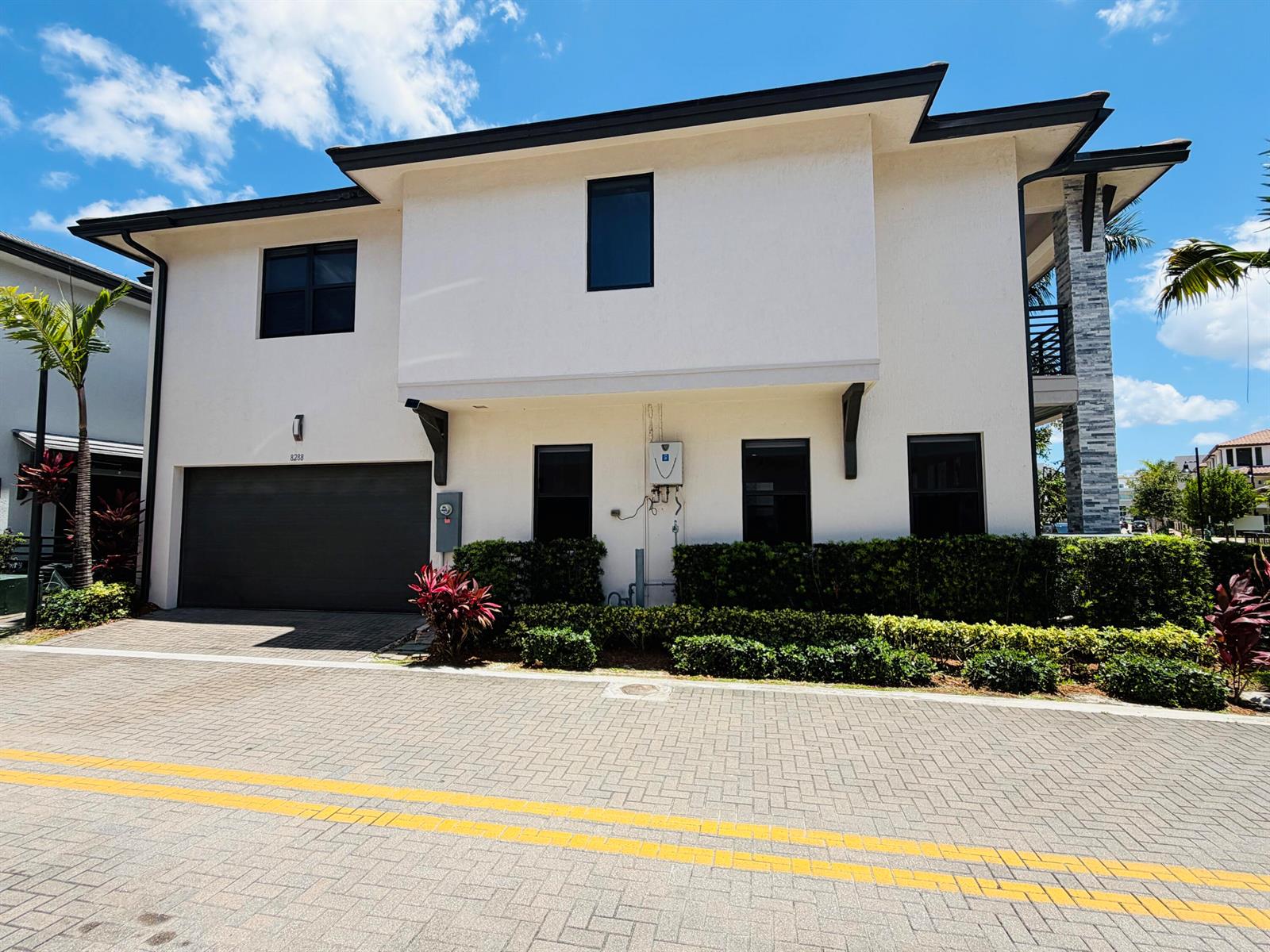 A two-story white house with a dark garage door and a paved driveway — 8288 NW 44th Terrace, Doral FL 33166, DORAL, FL