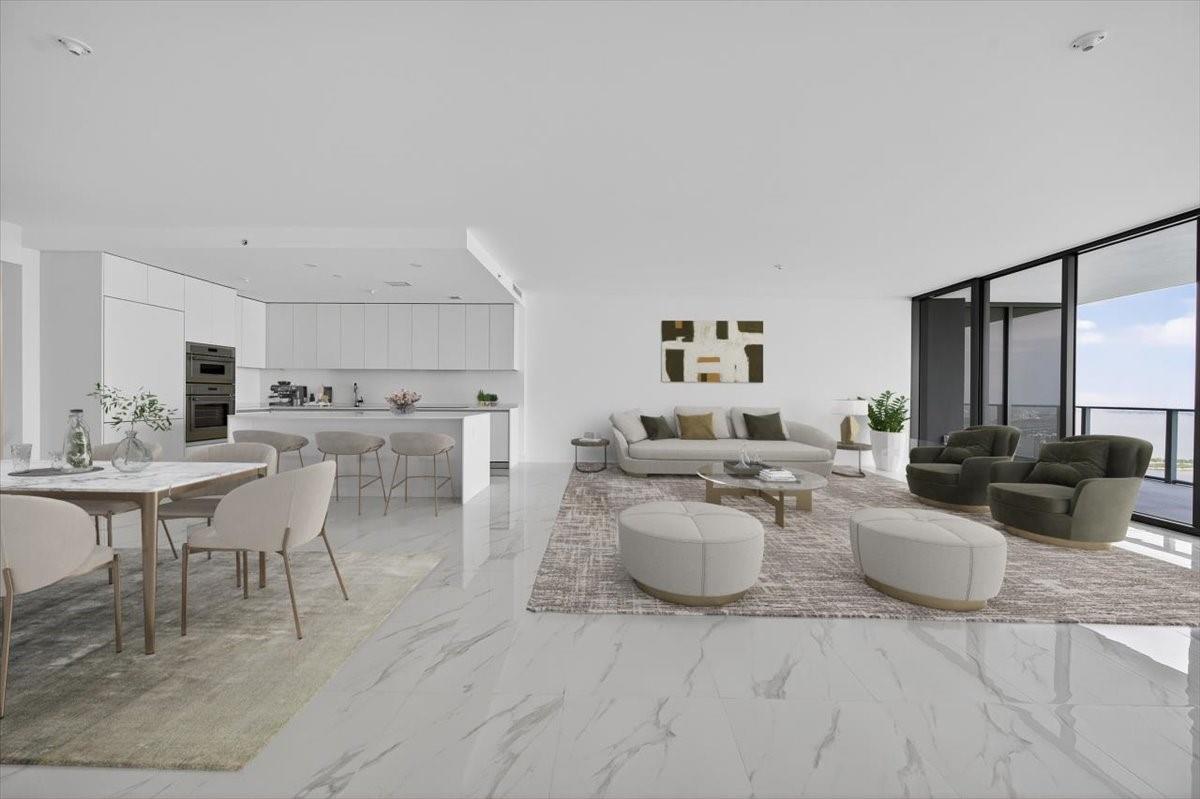This modern open-concept living area features white marble floors, a kitchen island, and floor-to-ceiling windows — 700 NE 24th Street # 5202, Miami FL 33137, MIAMI, FL