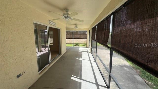 A single-story house with a beige stucco exterior, shingle roof, and a landscaped front yard — 2877 FEUSTEL AVENUE, THE VILLAGES, FL