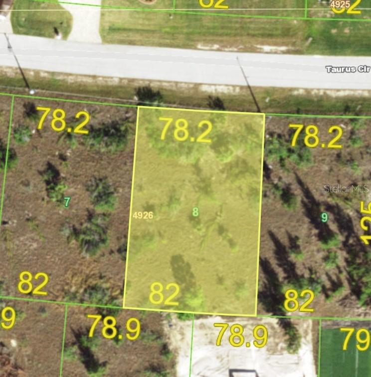 This is a map showing a rectangular residential lot highlighted in yellow — 15061 TAURUS CIRCLE, PORT CHARLOTTE, FL