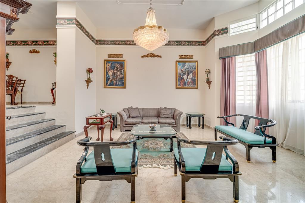 A formal living room features a crystal chandelier, marble flooring, and Asian-inspired furniture — Cll 1 STREET UNIT 602, GUAYNABO, PR