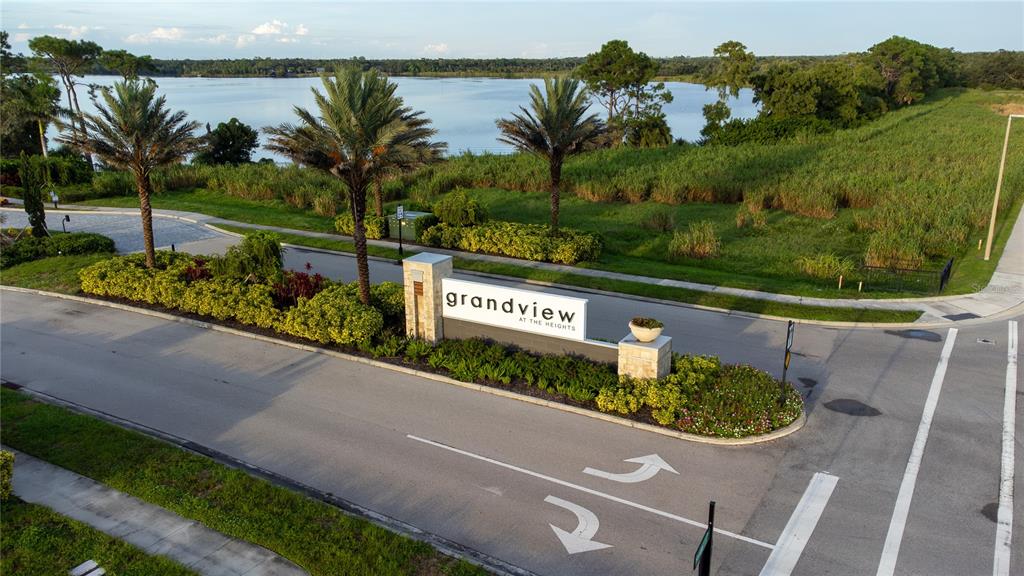 An aerial view shows the entrance sign for Grandview at the Heights near a lake — 6378 GRANDVIEW HILL COURT, BRADENTON, FL