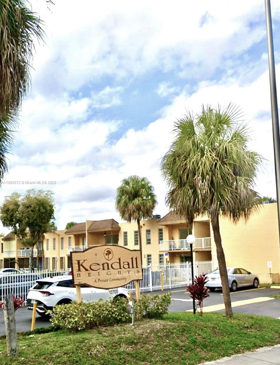 A sign for Kendall Heights stands in front of a multi-story apartment complex with palm trees — 13700 SW 62nd St # 250, Miami FL 33183, MIAMI, FL