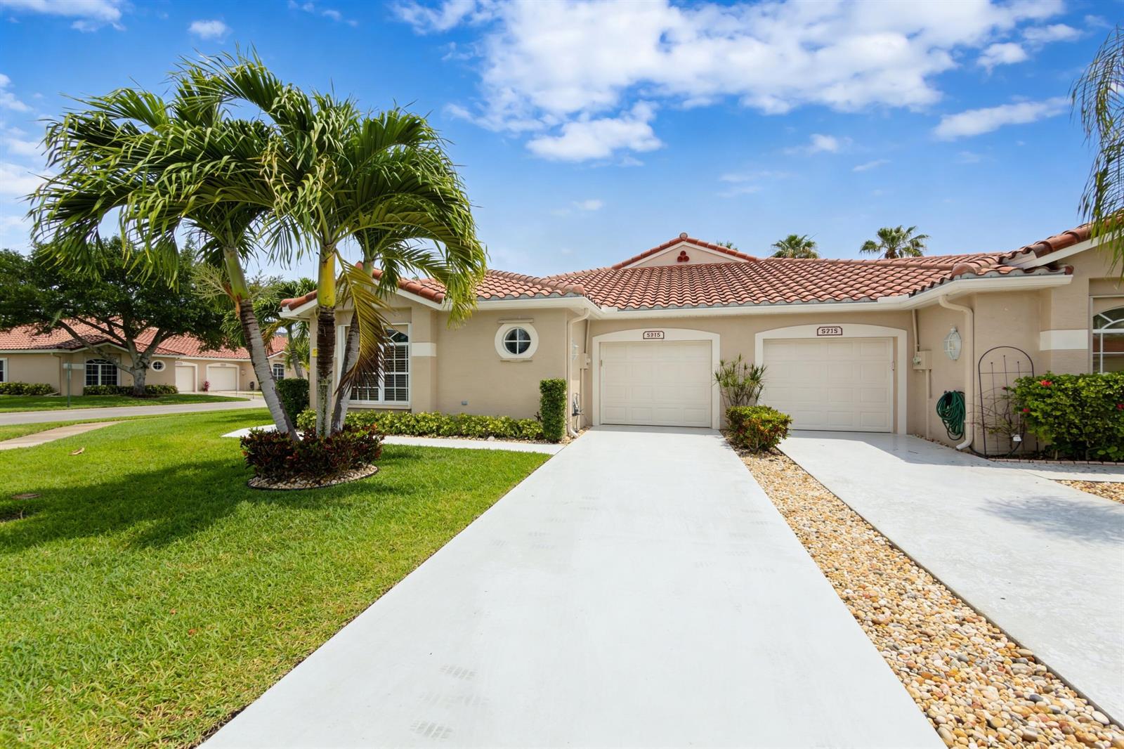 A single-story house with a tile roof, two garage doors, and a palm tree — 6419 Long Key Lane, Boynton Beach FL 33472, BOYNTON BEACH, FL