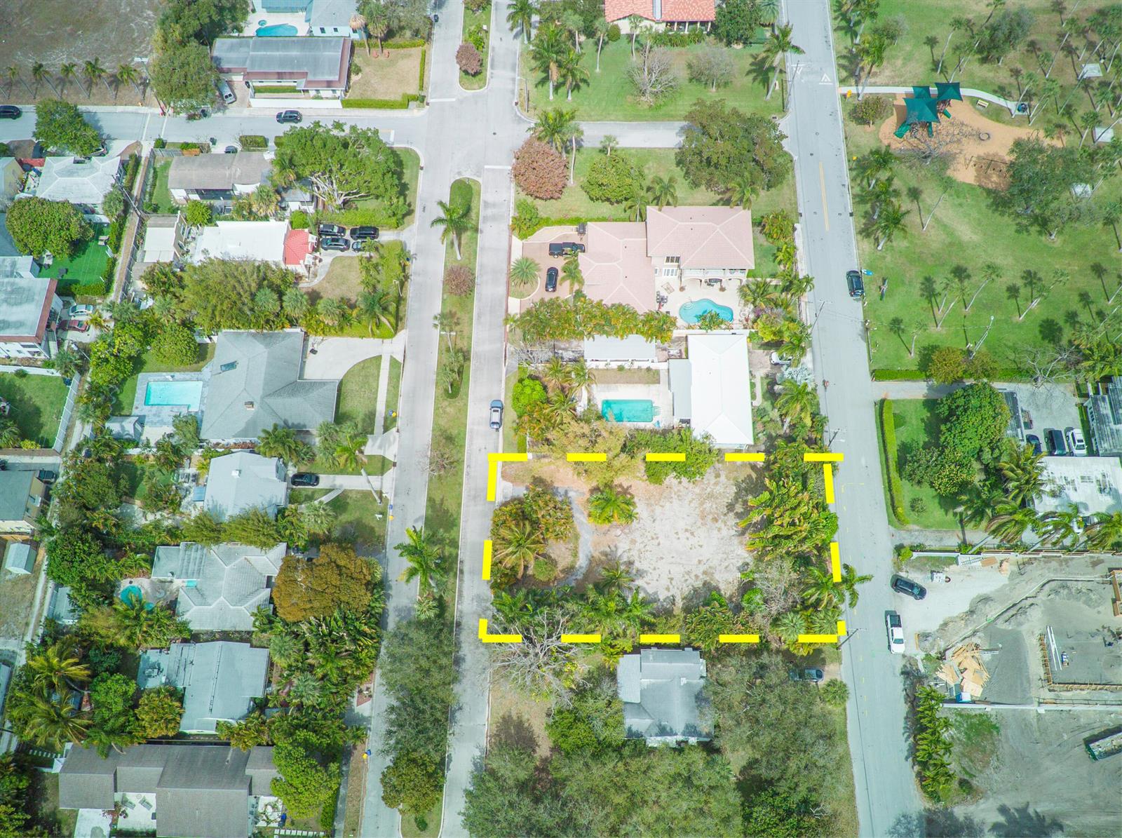 An aerial view shows a vacant residential lot outlined in yellow between two paved streets — 1118 S Palmway, FL 33460, FL