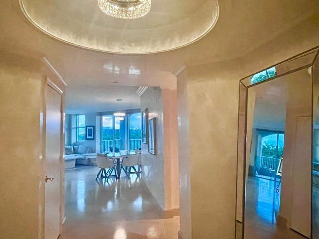 A hallway with a circular ceiling feature leads into a bright living and dining area — 3720 S Ocean Boulevard # 301b, Highland Beach FL 33487, HIGHLAND BEACH, FL