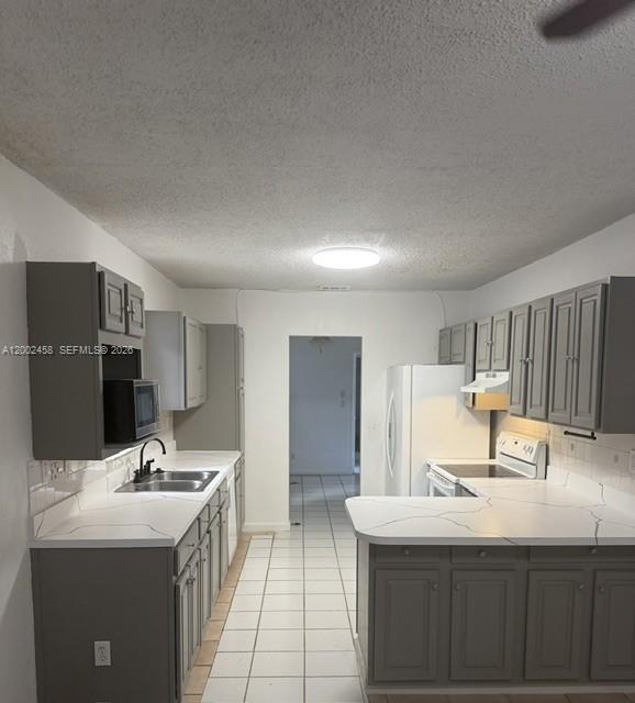 A single-story house with a chain-link fence and a palm tree in the front yard — 19920 SW 118th Pl # 0, Miami FL 33177, MIAMI, FL