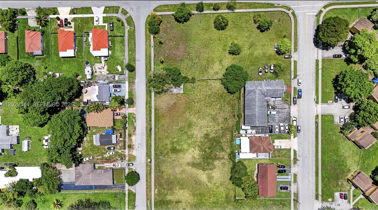 An aerial view shows a large vacant lot situated between residential streets and buildings — 10330 SW 178th St, Miami FL 33157, MIAMI, FL
