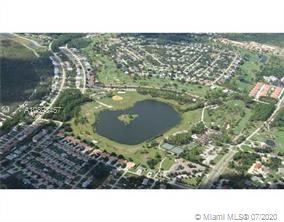 An aerial view shows a residential neighborhood surrounding a large lake and a golf course — 4500 FETTUCCINE AVE, Sebring FL 33872, SEBRING, FL
