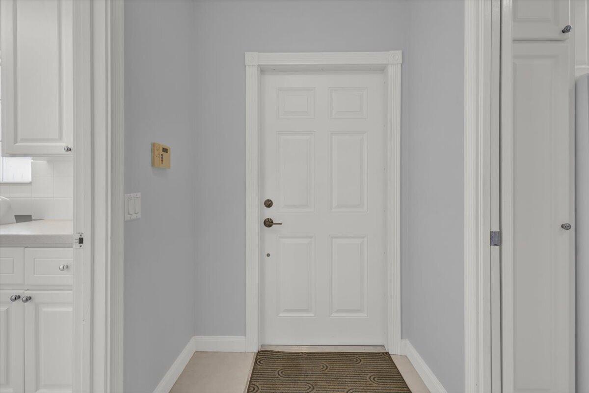 A white six-panel door is centered in a room with light gray walls and trim — 10882 SW Dardanelle Drive, FL 34987, FL