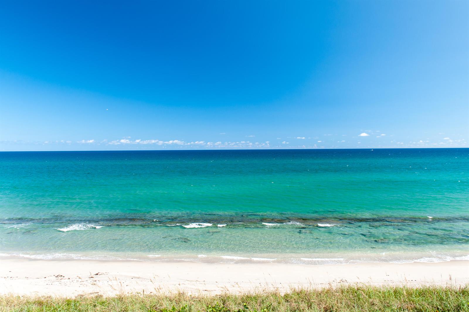 A view of a sandy beach and turquoise ocean under a clear blue sky — 2000 S Ocean Boulevard # 308n, Palm Beach FL 33480, PALM BEACH, FL