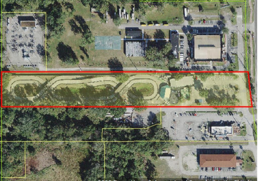 An aerial map view shows a long, rectangular property featuring a winding outdoor track — 4708 W IRLO BRONSON MEMORIAL HIGHWAY, KISSIMMEE, FL