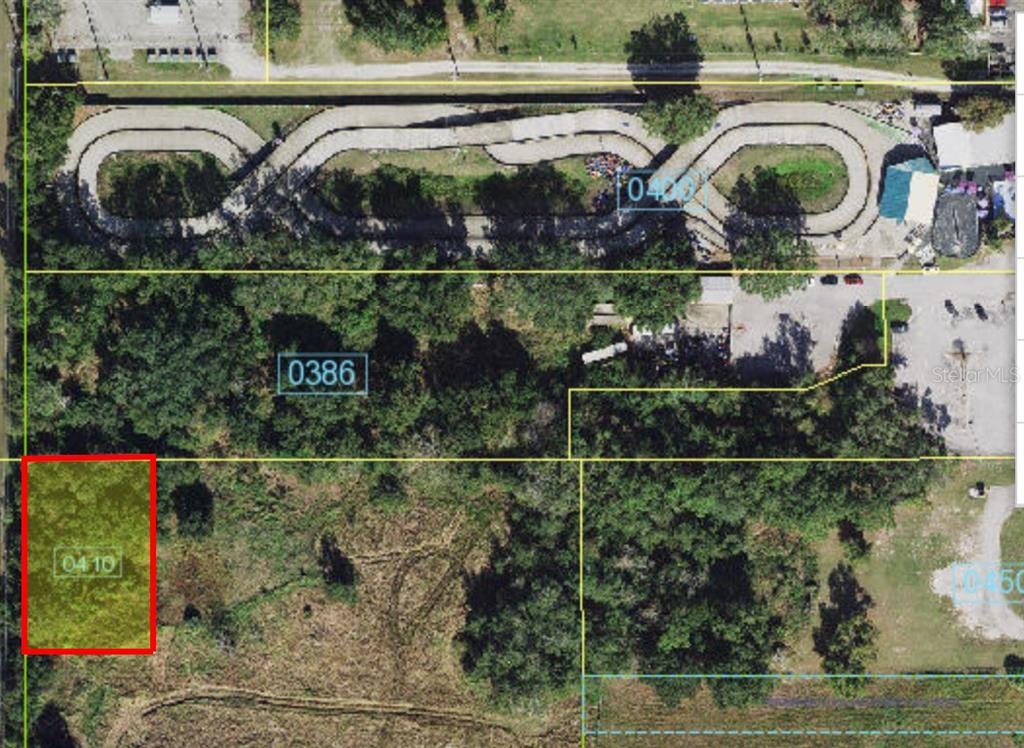 This is an aerial map showing a highlighted rectangular land parcel near a go-kart track — 4708 W IRLO BRONSON MEMORIAL HIGHWAY, KISSIMMEE, FL