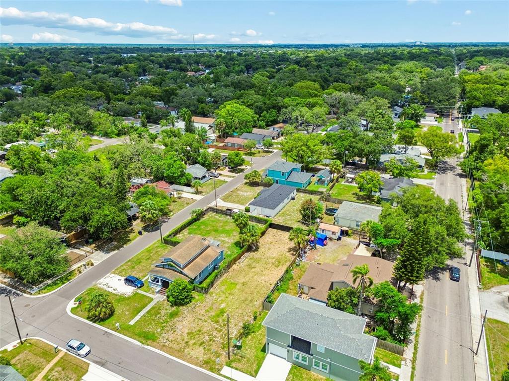 An aerial view shows several houses and vacant lots in a residential neighborhood — 4805 N 10TH STREET, TAMPA, FL