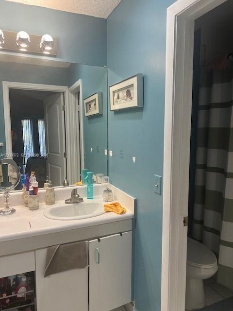 A bathroom features a white vanity with a sink, a mirror, and blue painted walls — 150 Colly Way, North Lauderdale FL 33068, NORTH LAUDERDALE, FL
