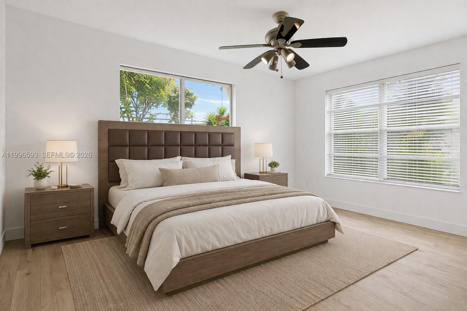 A bedroom features a brown upholstered headboard, a ceiling fan, and two windows with blinds — 1357 SW 4th Ter, Pompano Beach FL 33060, POMPANO BEACH, FL