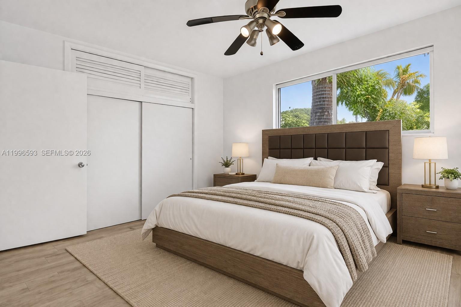 A bedroom features a bed with a brown headboard, two nightstands, and a ceiling fan — 1357 SW 4th Ter, Pompano Beach FL 33060, POMPANO BEACH, FL