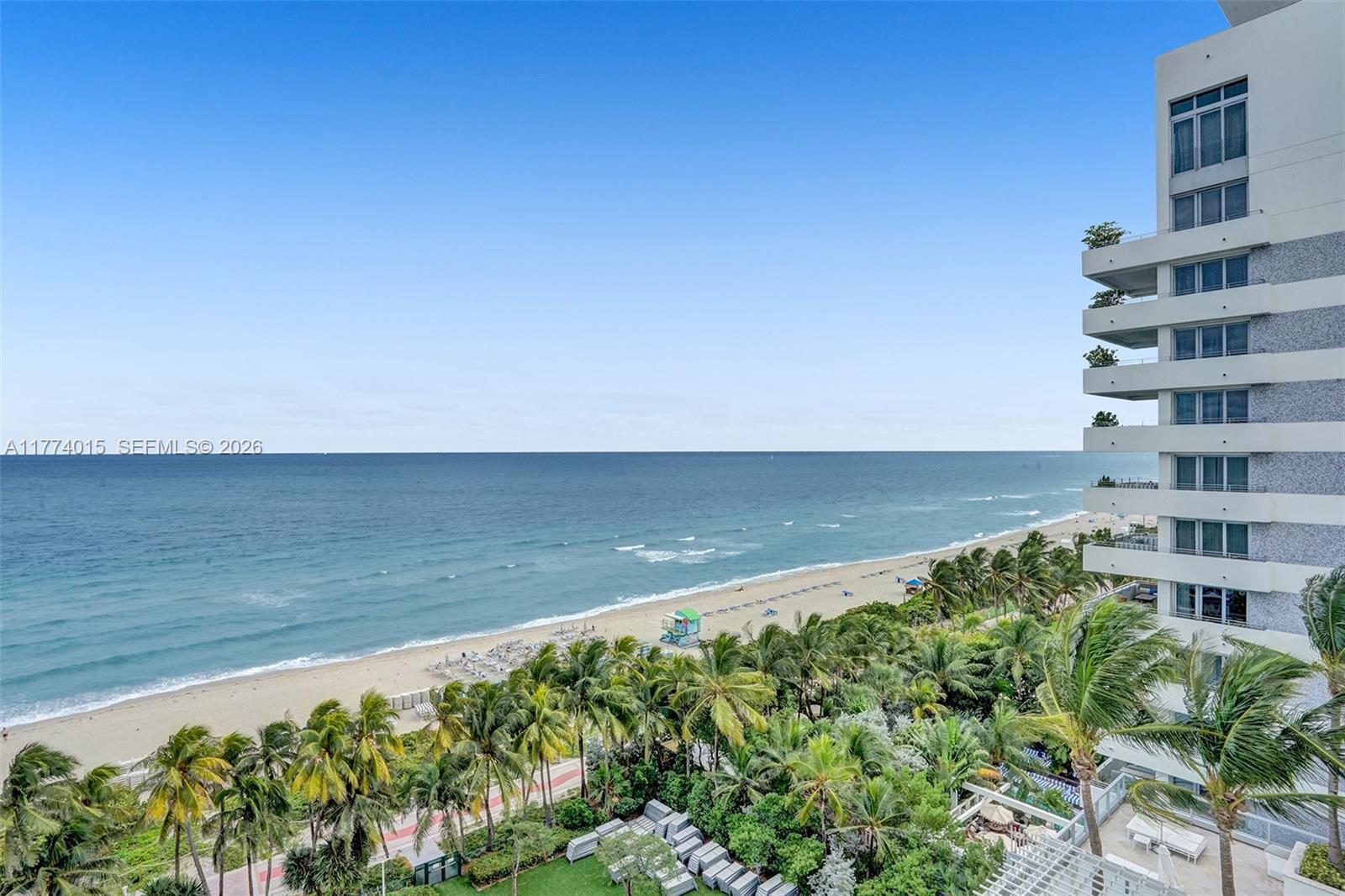 An elevated view shows a sandy beach, ocean, and palm trees next to a high-rise building — 4391 Collins Ave, Miami Beach FL 33140, MIAMI BEACH, FL