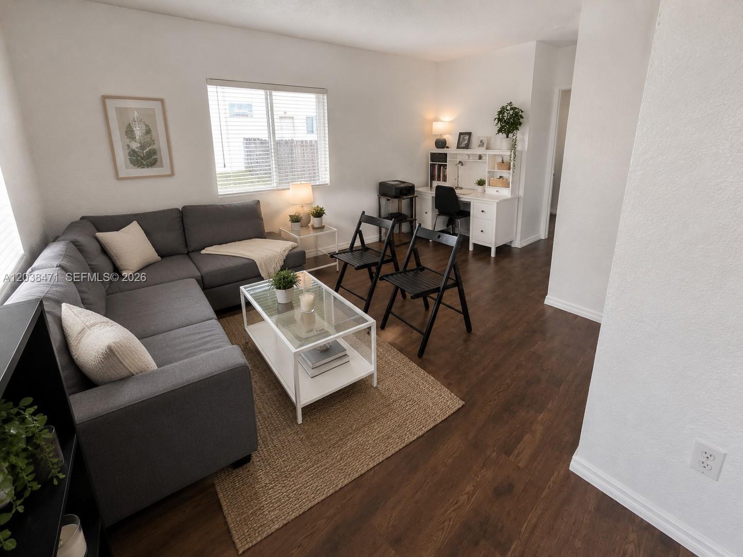 A living room features a grey sectional sofa, a glass coffee table, and a desk area — 300 NW 84th Ter # 300, Miami FL 33150, MIAMI, FL