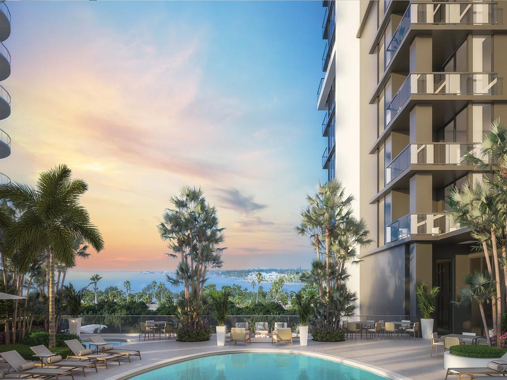 This is a rendering of a modern hotel lobby featuring a marble reception desk and sculpture — 1000 BOULEVARD OF THE ARTS UNIT 1005, SARASOTA, FL