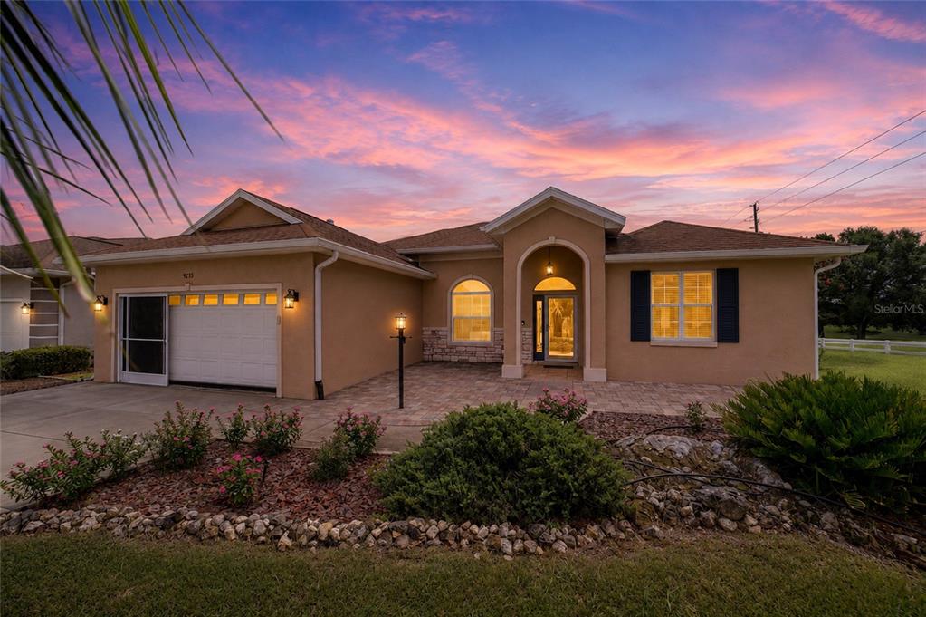 An entryway with tile flooring, a white front door, and an adjacent dining area — 9275 SW 99TH COURT ROAD, OCALA, FL