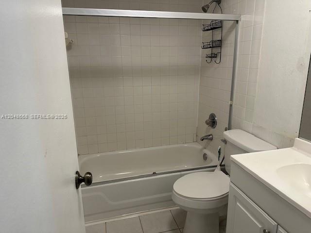 A bathroom features a white bathtub with a shower, a toilet, and a vanity sink — 5252 Bosque Ln # 9, West Palm Beach FL 33415, WEST PALM BEACH, FL