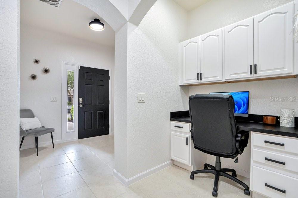 A home office area features white cabinetry, a black desk, and a black office chair — 1259 FALLING STAR LANE, ORLANDO, FL