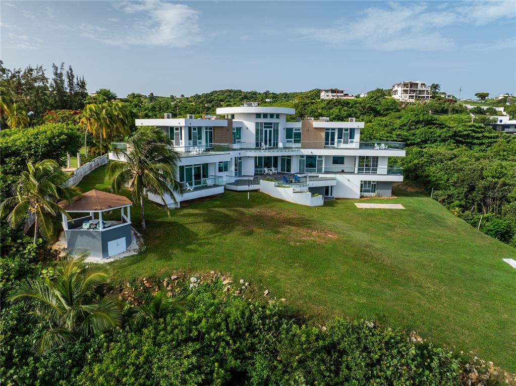An aerial view of a modern multi-story white house with a gazebo and large lawn — 991 CALLE ESTACION, QUEBRADILLAS, PR