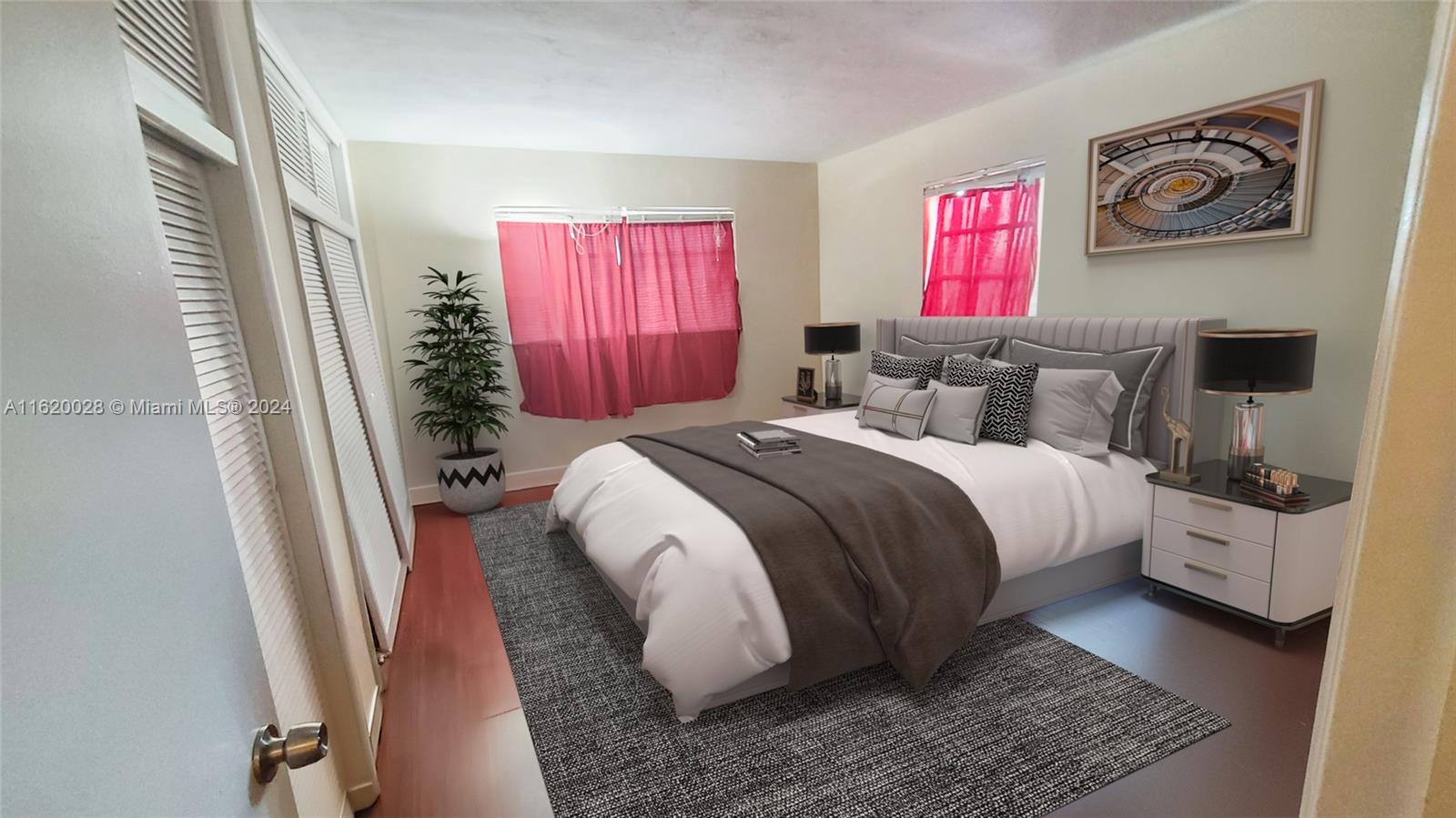 This bedroom features a bed with grey bedding, a dark area rug, and pink curtains — 7410 SW 82nd St # K211, Miami FL 33143, MIAMI, FL