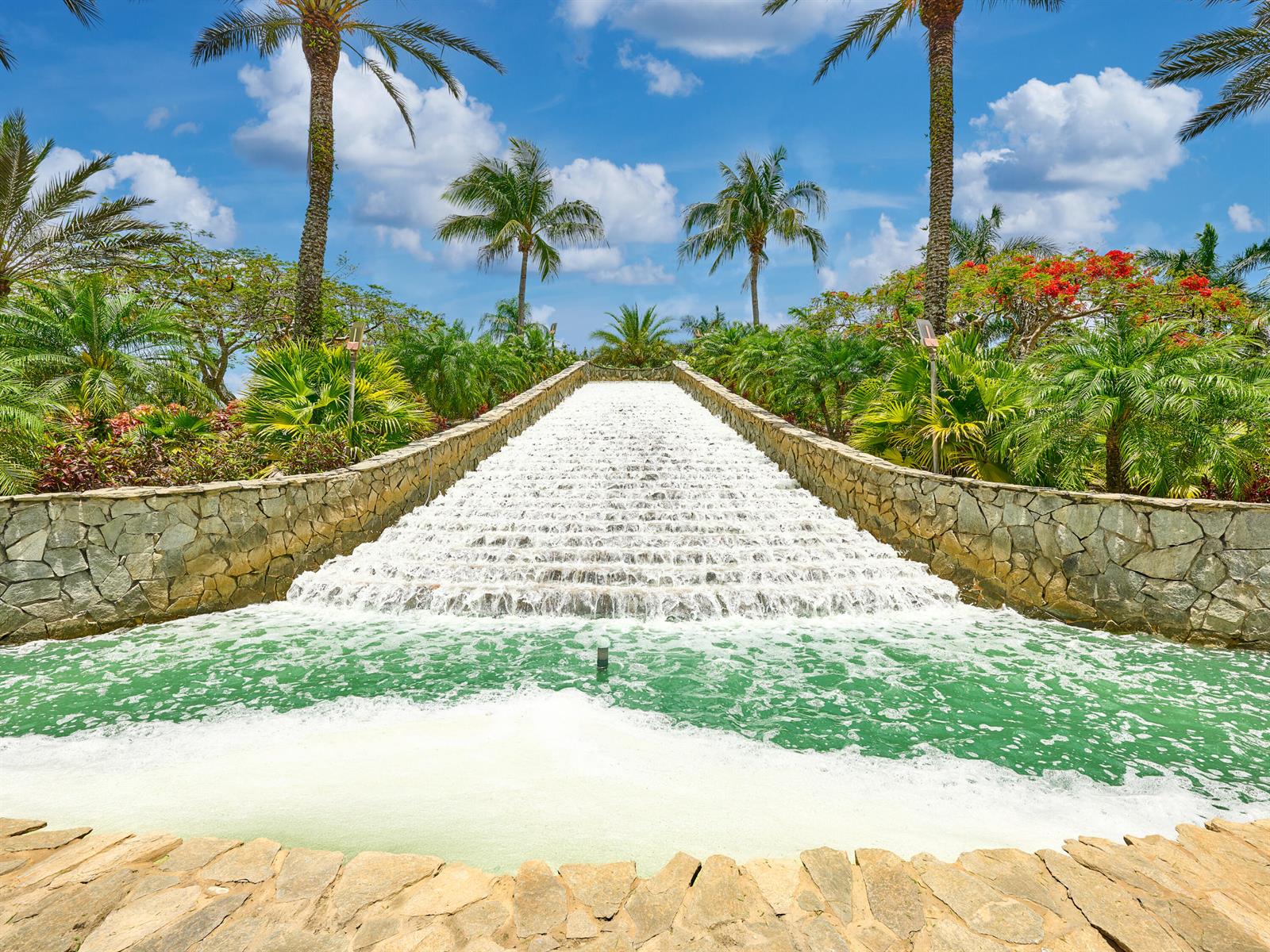 A single-story house with a paved walkway, a garage, and tropical landscaping under a sky — 2649 Clipper Circle, West Palm Beach FL 33411, WEST PALM BEACH, FL