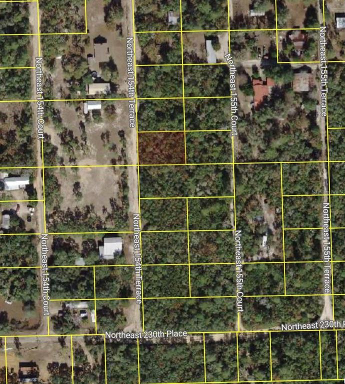This is an aerial map showing residential land parcels and street layouts — NE 154TH TERRACE, FORT MC COY, FL