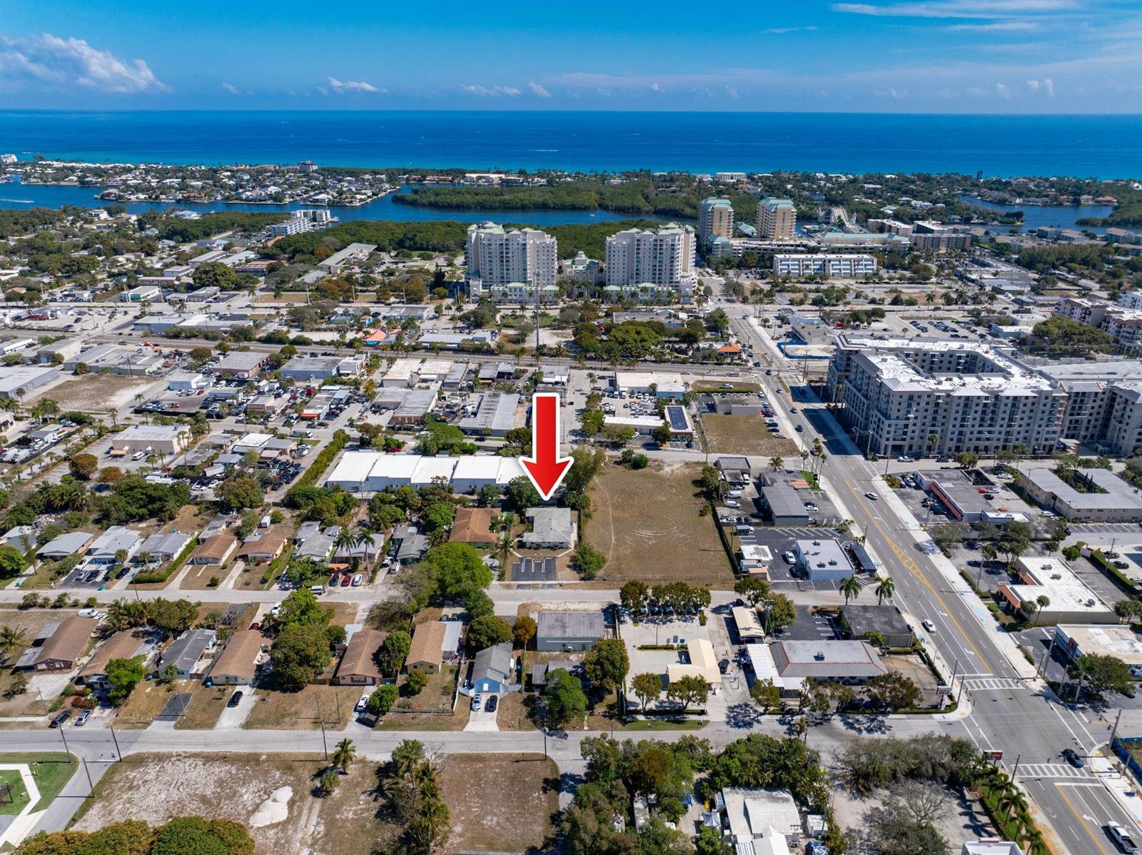 An aerial view shows a single-story building marked by a red arrow in a neighborhood — 400 NE 2nd Street, Boynton Beach FL 33435, BOYNTON BEACH, FL