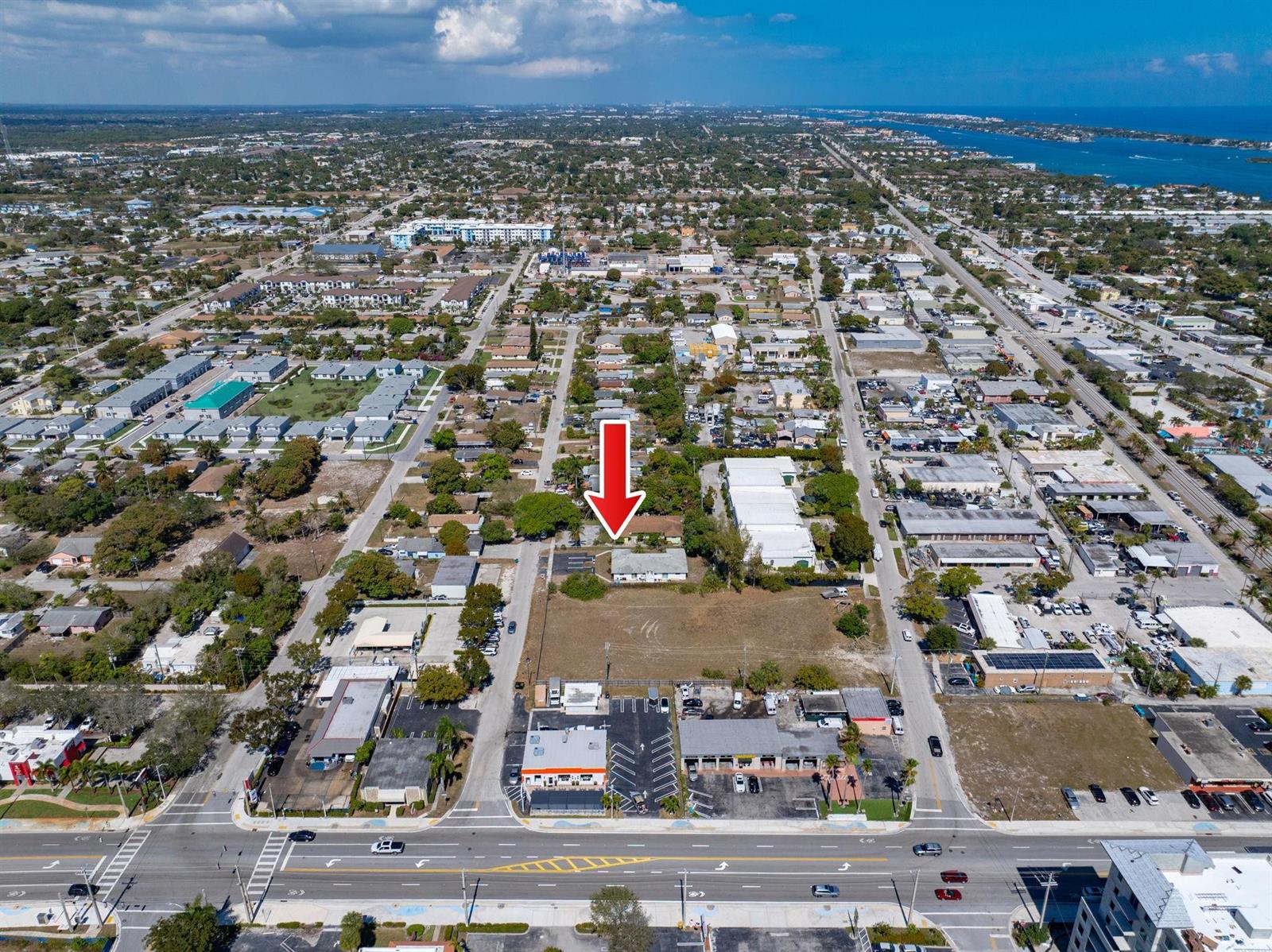 An aerial view shows a commercial building with a large adjacent vacant lot — 400 NE 2nd Street, Boynton Beach FL 33435, BOYNTON BEACH, FL