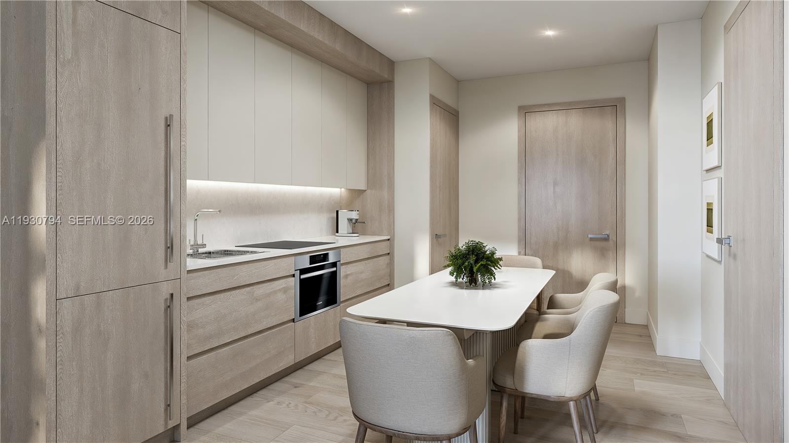This kitchen features light wood cabinetry, a white dining table, and integrated appliances — 1741 SW 2nd Avenue # 331, Miami FL 33129, MIAMI, FL