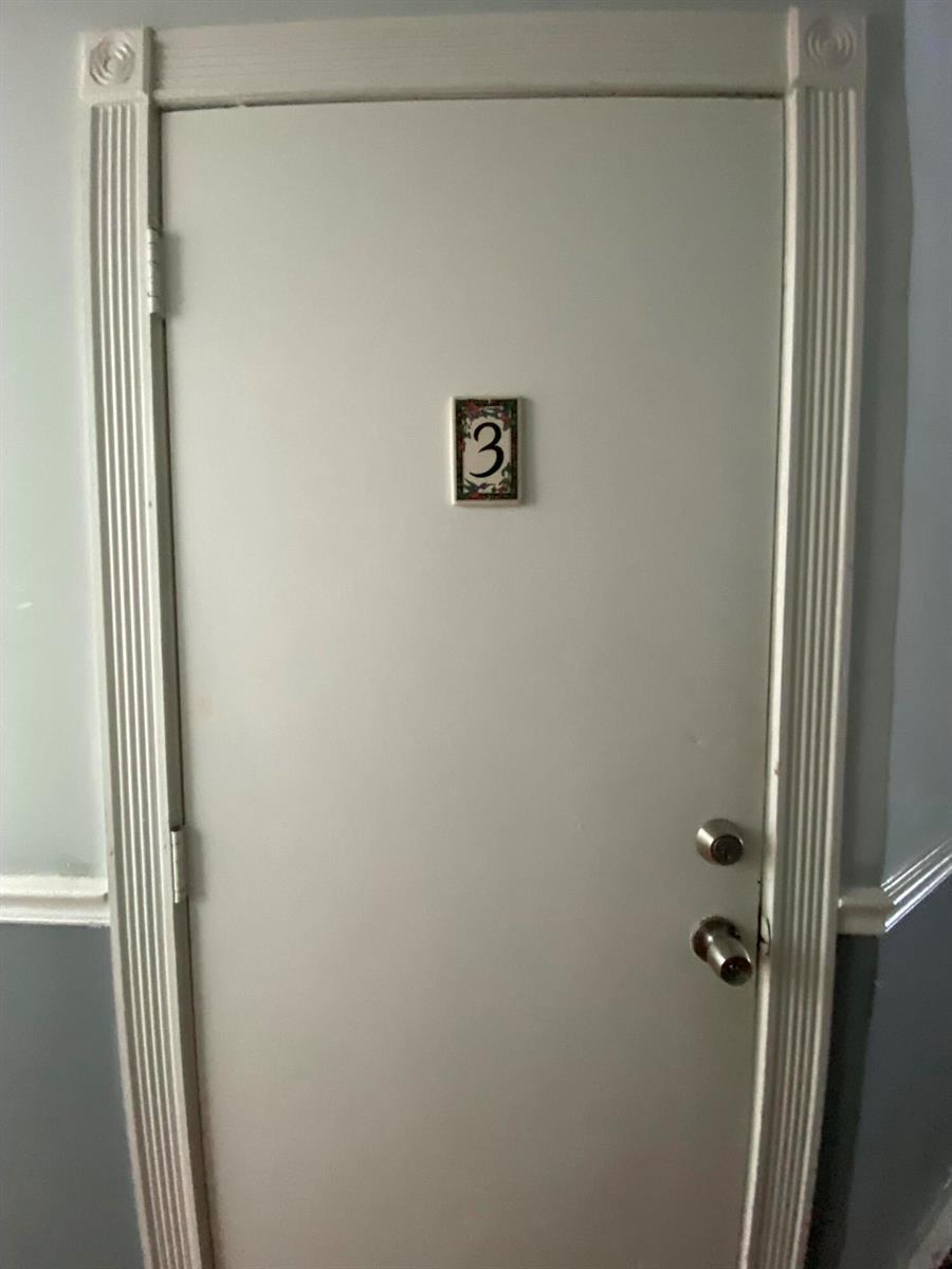 A white interior door features a decorative number three plaque and two silver locks — 250 Seminole Avenue # 3, Palm Beach FL 33480, PALM BEACH, FL