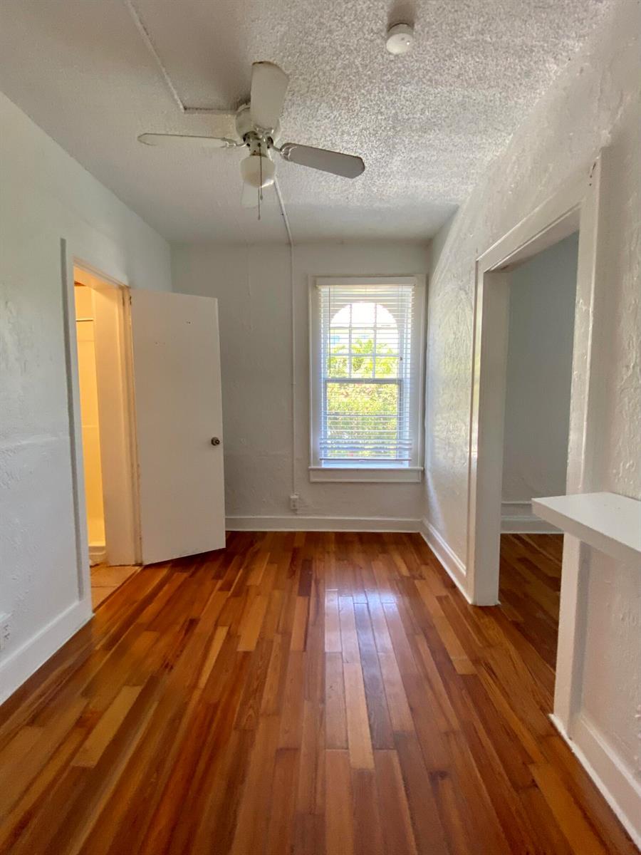 A small room with hardwood floors, a ceiling fan, and a window with white blinds — 250 Seminole Avenue # 3, Palm Beach FL 33480, PALM BEACH, FL