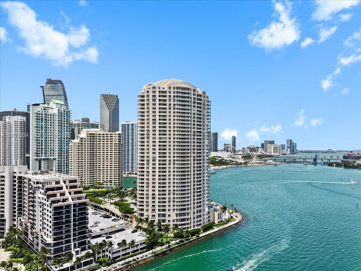 An aerial view of high-rise apartment buildings along a waterfront in a city — 808 BRICKELL KEY DR # 1205, Miami FL 33131, MIAMI, FL