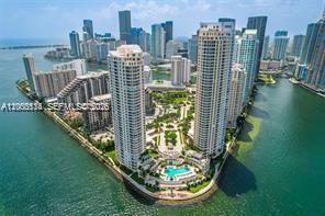 An aerial view of two high-rise residential towers surrounded by water and a landscaped park — 808 BRICKELL KEY DR # 1205, Miami FL 33131, MIAMI, FL