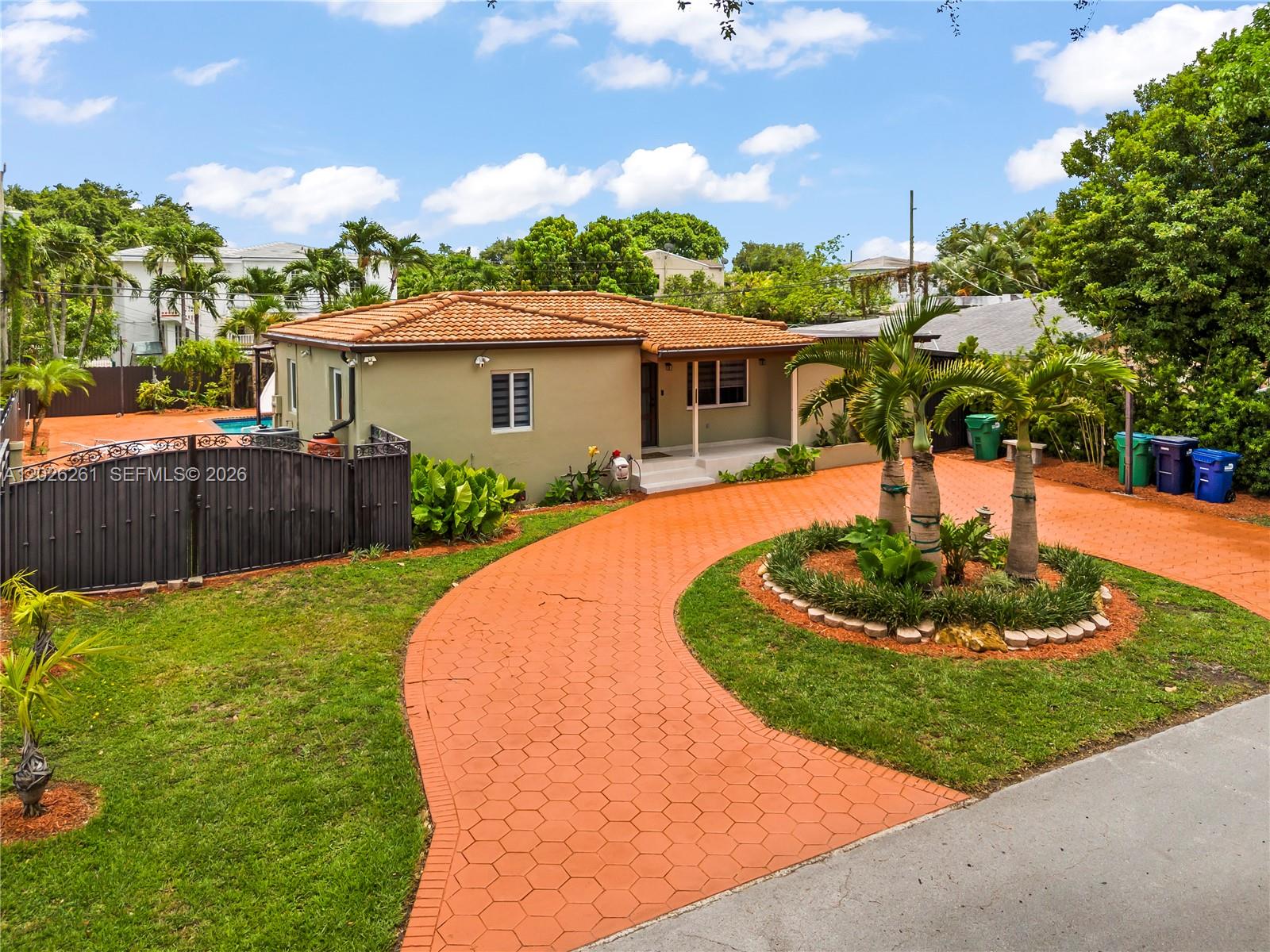 A single-story house with a terracotta tile roof and a circular orange paved driveway — 6250 SW 20 ter, Miami FL 33155, MIAMI, FL