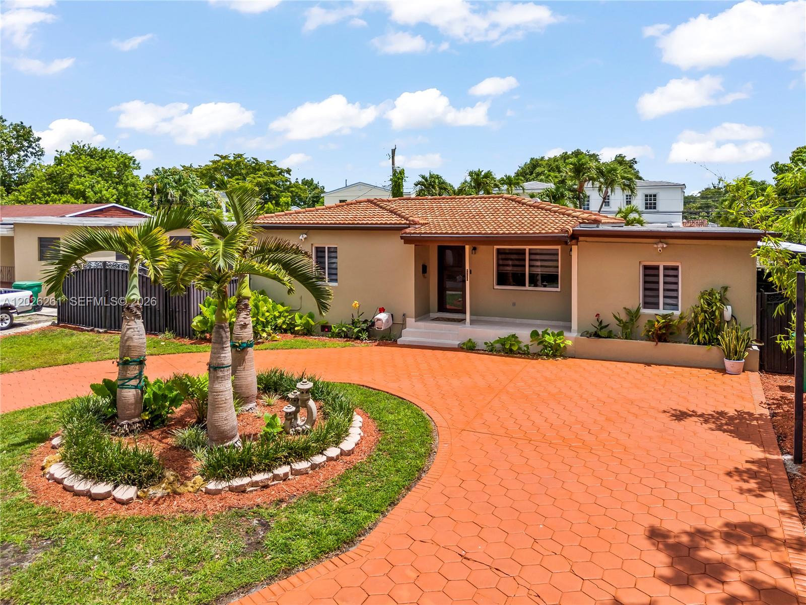 A single-story house with a terracotta tile roof and a circular paved driveway — 6250 SW 20 ter, Miami FL 33155, MIAMI, FL
