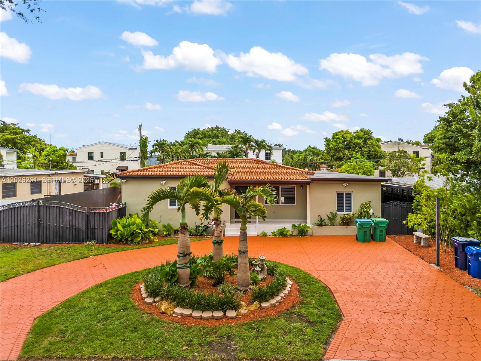 A single-story house with a terracotta tile roof features a circular driveway and palm trees — 6250 SW 20 ter, Miami FL 33155, MIAMI, FL