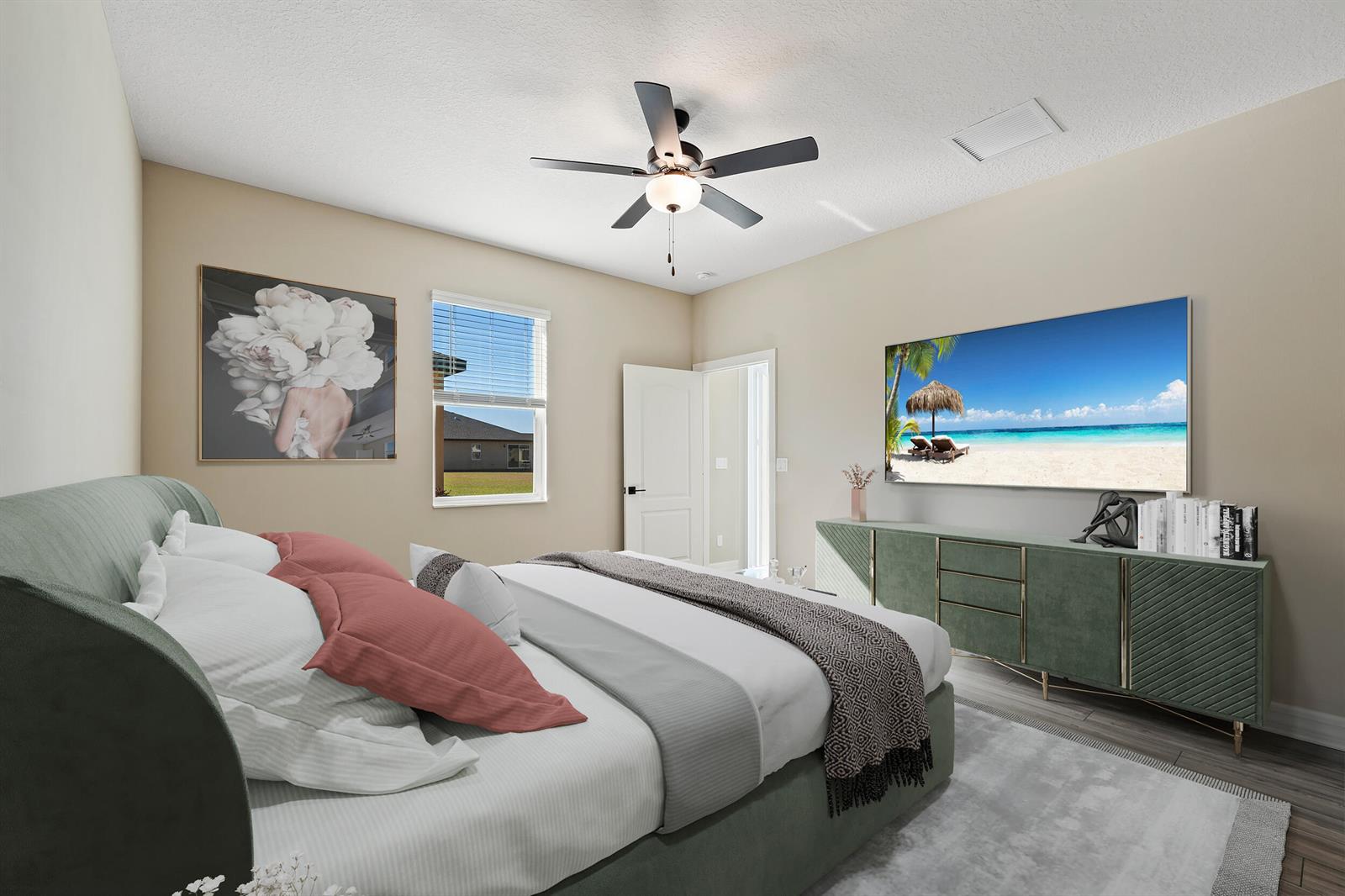 A bedroom features a green bed frame, a matching dresser, and a wall-mounted television — 1817 Party Place, Fort Pierce FL 34947, FORT PIERCE, FL