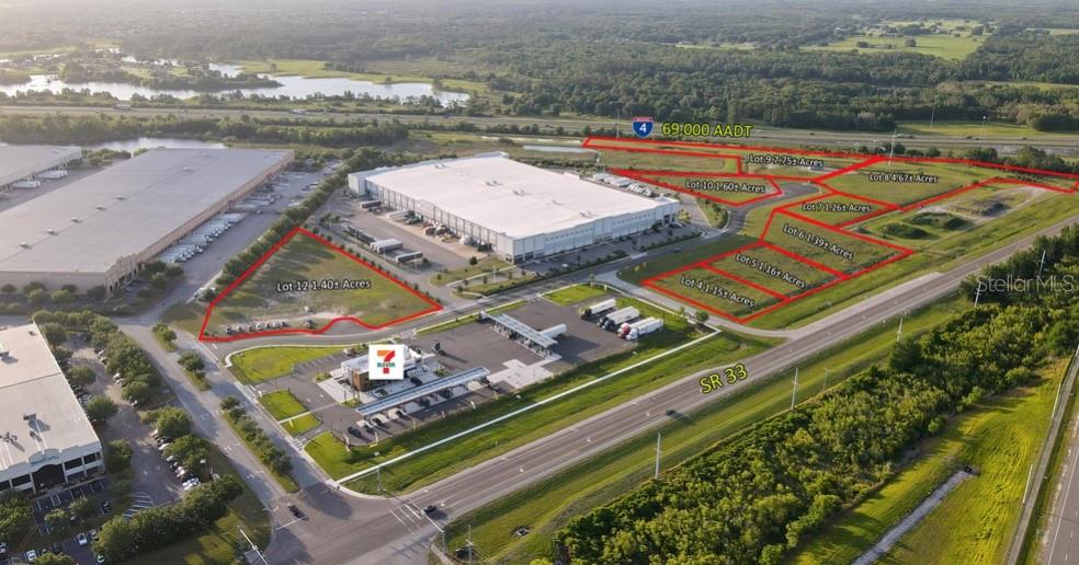 This aerial map shows several vacant commercial lots for sale near a highway and warehouse — 0 HWY 33 N, LAKELAND, FL