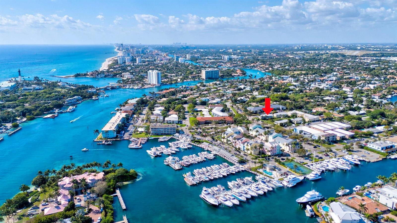 An aerial view shows a coastal residential area with a marina and a red arrow — 2755 NE 28th Avenue # A3, Lighthouse Point FL 33064, LIGHTHOUSE POINT, FL