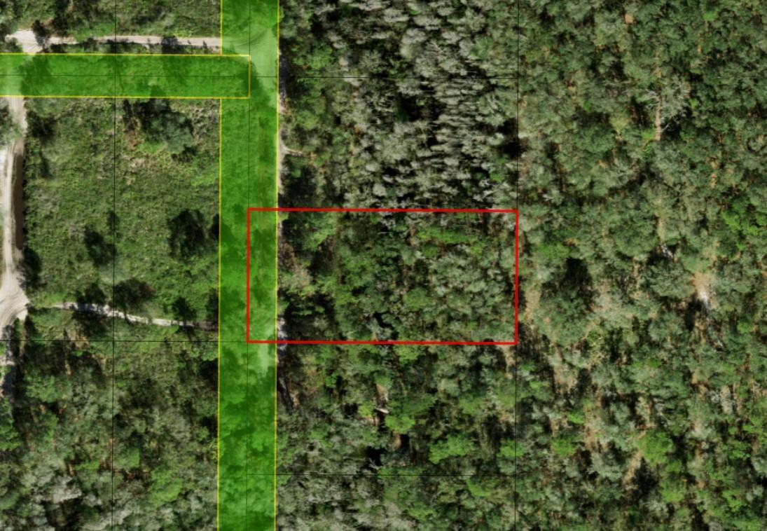 An aerial map view shows a rectangular plot of land outlined in red near roads — 0 County Rd 54, FL 33849, FL