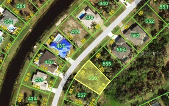 This is a satellite map view showing a vacant residential lot highlighted in yellow — 120 MARKER ROAD, ROTONDA WEST, FL