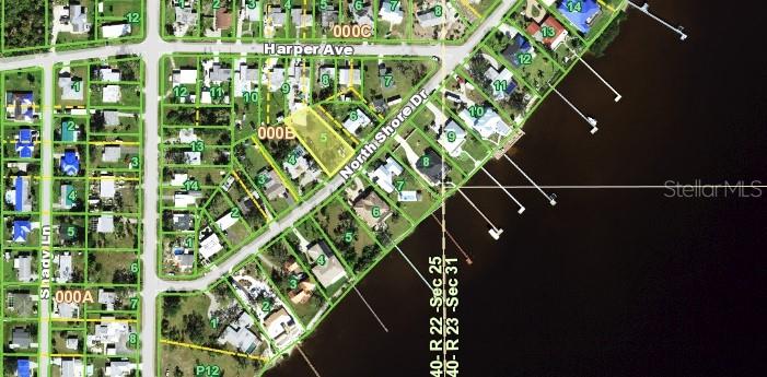 This is an aerial map showing a residential neighborhood and a waterfront property highlighted in yellow — 4467 NORTHSHORE DRIVE, PUNTA GORDA, FL